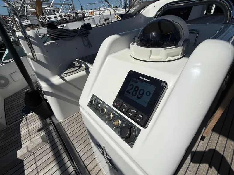 Slide: The Image of Jeanneau Sun Odyssey 410 helm with compass and navigation system, 2023 model. - 10