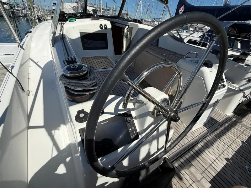 Slide: The Image of Cockpit of Jeanneau Sun Odyssey 410, 2023 model, docked at marina. - 14