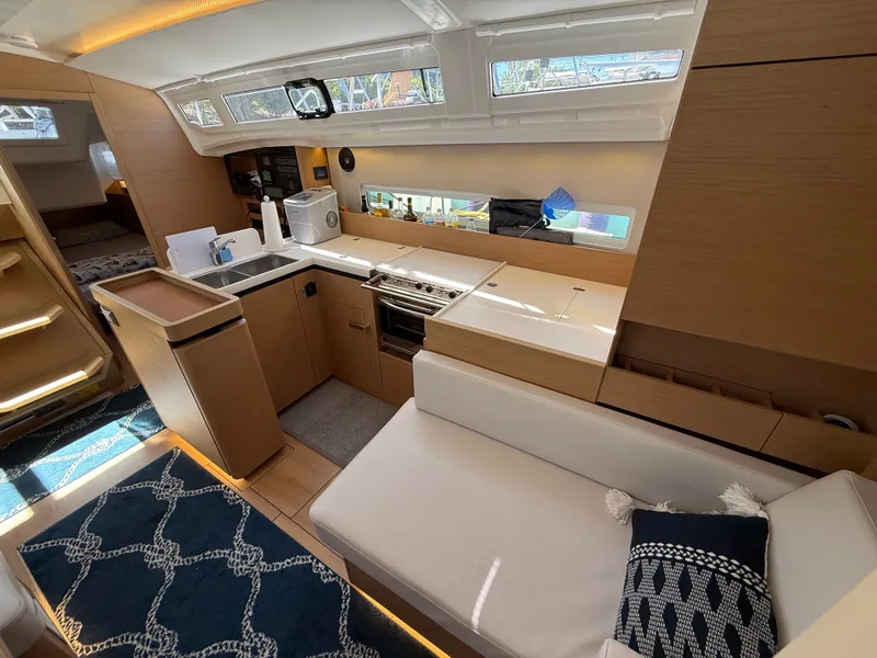 Slide: The Image of Interior of Jeanneau Sun Odyssey 410 yacht, modern kitchen and seating area. - 29