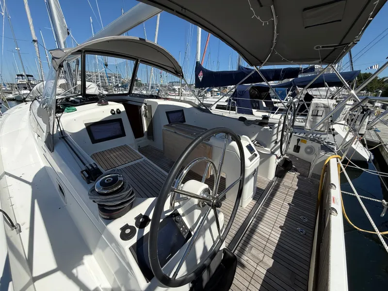 Slide: The Image of Jeanneau Sun Odyssey 410 sailboat cockpit, 2023 model, docked at marina. - 4