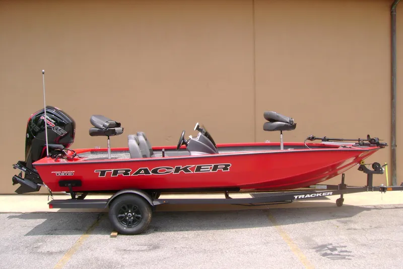 The Image of 2026 Tracker Pro Team 190 boat in vibrant red, parked on a trailer. - 0