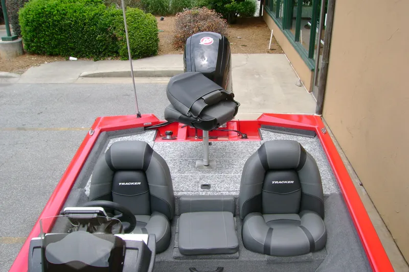 Slide: The Image of 2026 Tracker Pro Team 190 boat interior with seating and steering wheel. - 6