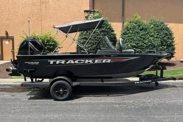The Image of 2026 Tracker Pro Guide V-175 WT boat on trailer, parked outdoors. - 0