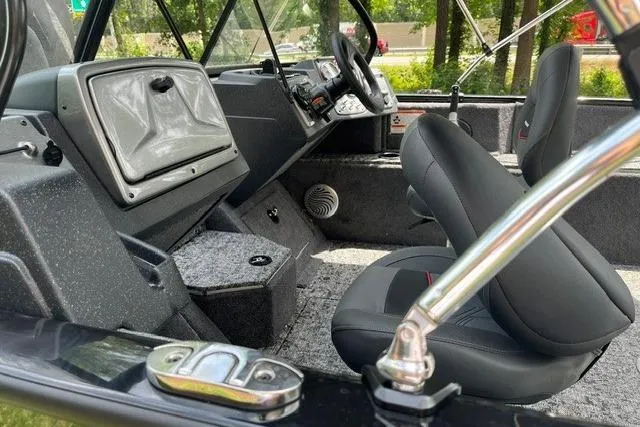 Slide: The Image of 2026 Tracker Pro Guide V-175 WT boat interior with modern dashboard and seating. - 7