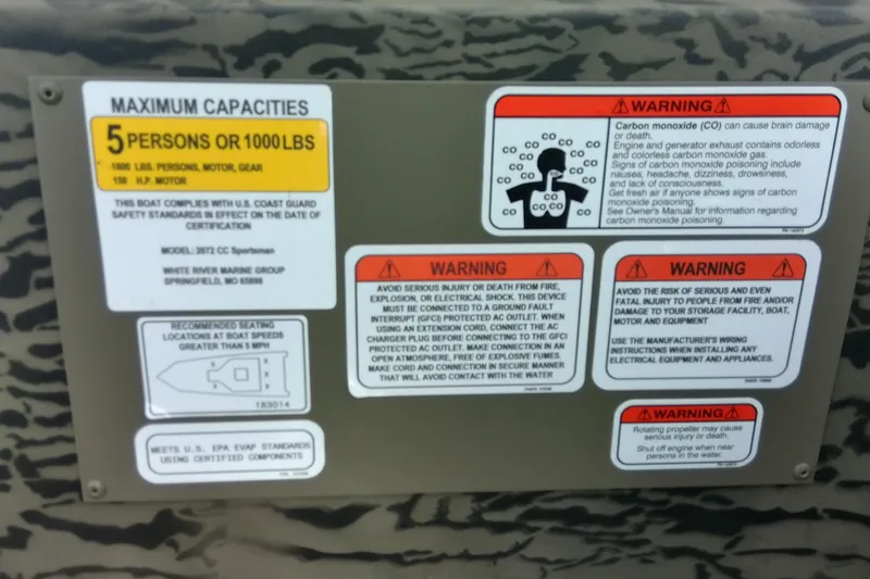Slide: The Image of Capacity and warning labels on 2026 Tracker Grizzly 2072 CC Sportsman boat. - 14