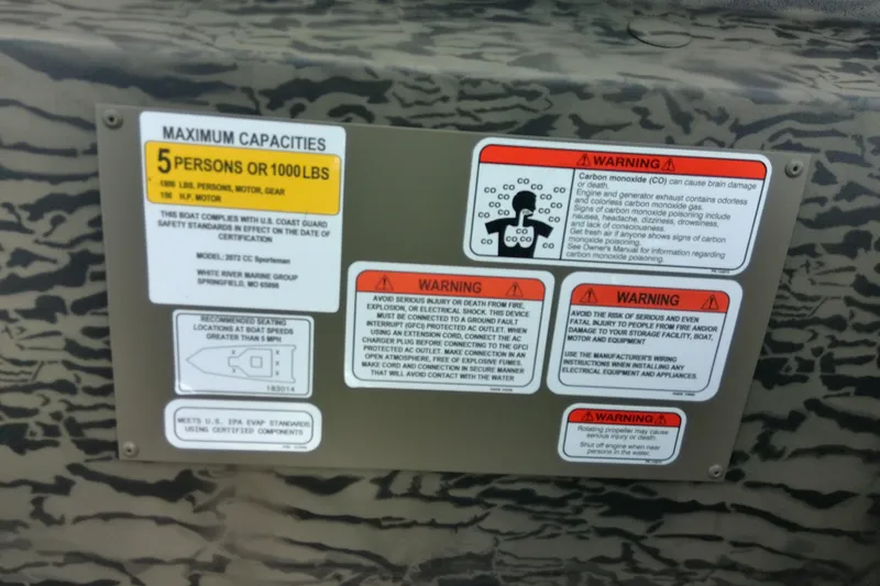 Slide: The Image of Capacity and warning labels on 2026 Tracker Grizzly 2072 CC Sportsman boat. - 91