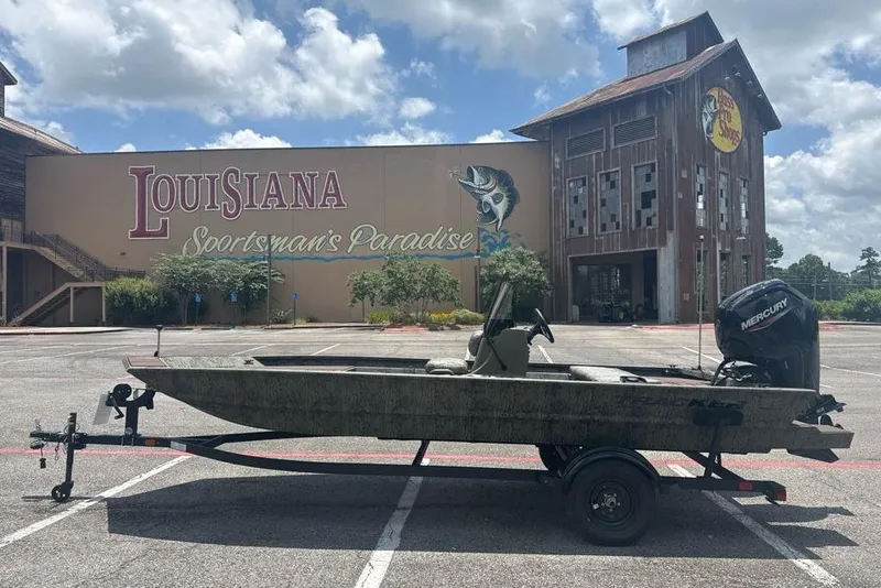 Slide: The Image of 2026 Tracker Grizzly 1860 CC boat parked at Louisiana Sportsman's Paradise. - 2