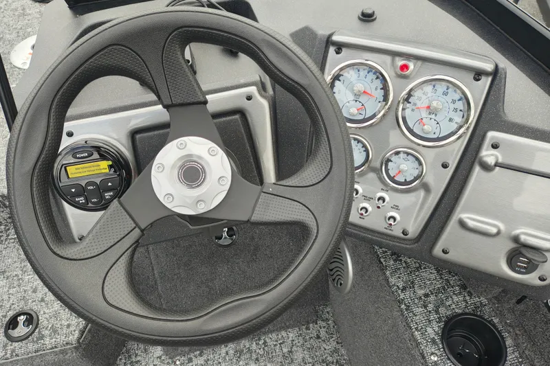 Slide: The Image of Steering wheel and dashboard of 2026 Tracker Pro Guide V-175 WT boat. - 10