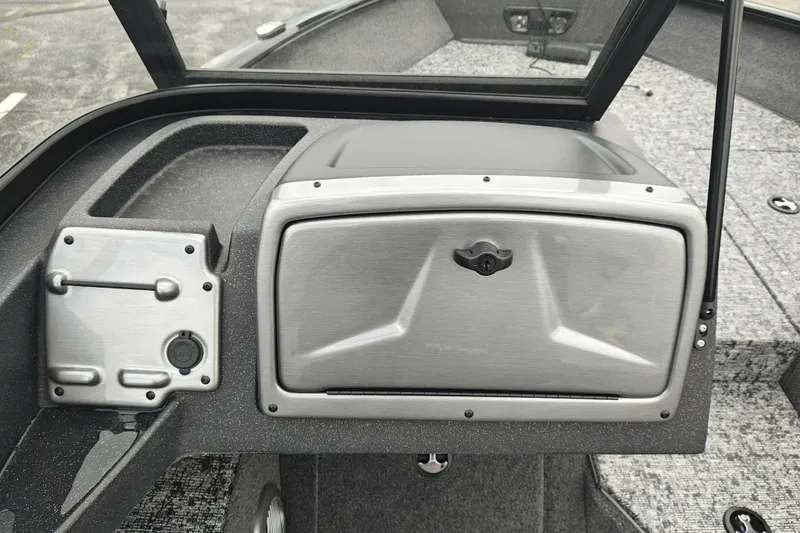 Slide: The Image of 2026 Tracker Pro Guide V-175 WT boat dashboard with storage compartment and USB port. - 11