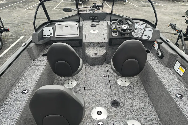 Slide: The Image of 2026 Tracker Pro Guide V-175 WT boat interior with seating and control panel. - 6