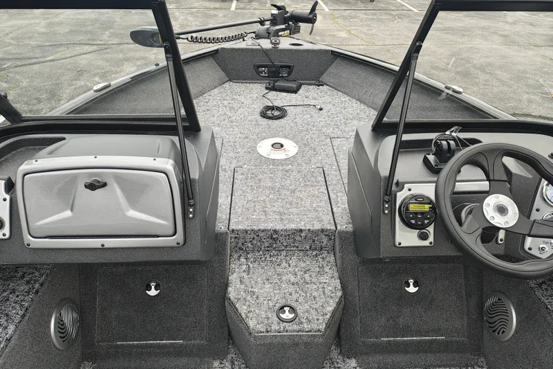 Slide: The Image of 2026 Tracker Pro Guide V-175 WT boat interior with steering wheel and control panel. - 8