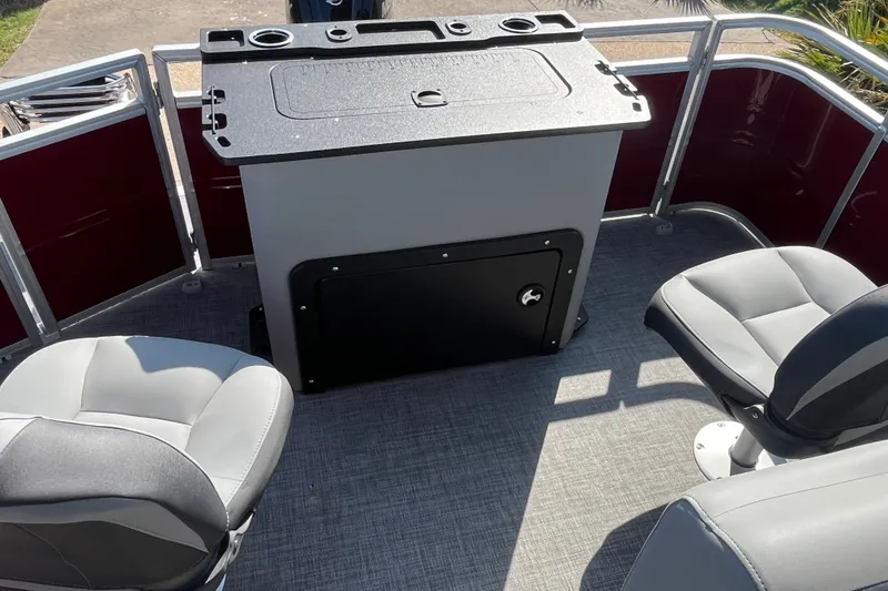 Slide: The Image of 2026 Sun Tracker SportFish 20 DLX boat interior with seating and storage area. - 16