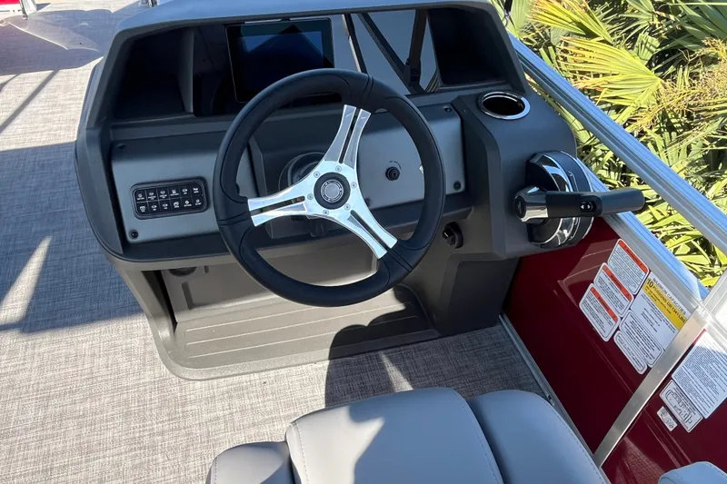 Slide: The Image of Steering console of 2026 Sun Tracker SportFish 20 DLX boat with modern controls. - 14