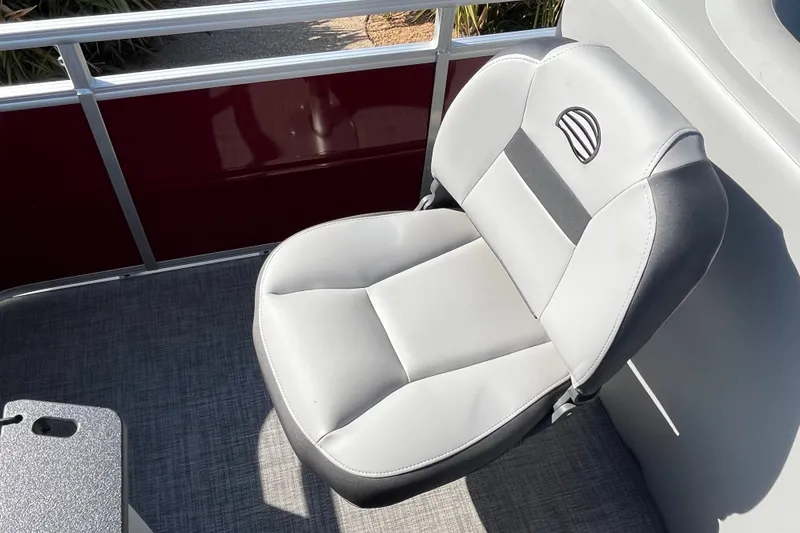 Slide: The Image of 2026 Sun Tracker SportFish 20 DLX boat seat, featuring sleek gray upholstery and modern design. - 18