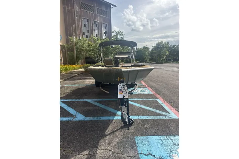 Slide: The Image of 2026 Tracker Grizzly 1756 T Marsh boat parked in a sunny lot. - 4