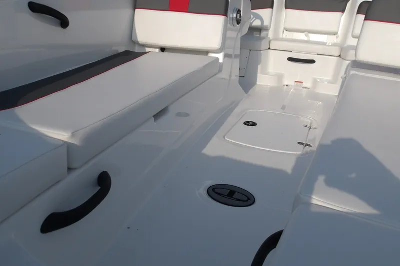 Slide: The Image of 2026 Tahoe T18 boat interior with white seating and storage compartments. - 22