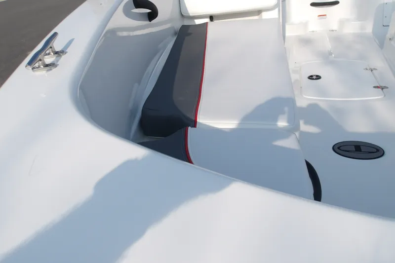Slide: The Image of 2026 Tahoe T18 boat interior with white and gray seating, red accents, and storage compartments. - 17