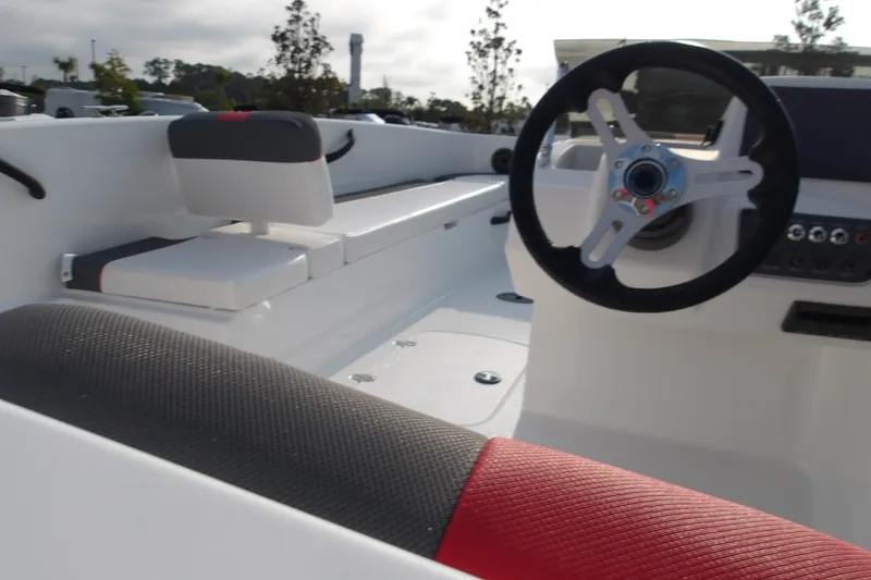 Slide: The Image of 2026 Tahoe T18 boat interior with steering wheel and seating, showcasing modern design. - 25