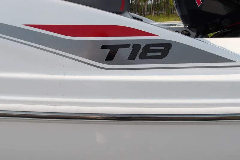 Slide: The Image of 2026 Tahoe T18 boat side view with red and gray graphics. - 20