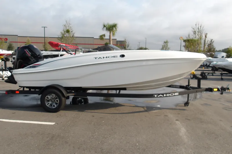 Slide: The Image of 2026 Tahoe T18 boat on trailer in outdoor setting. - 21