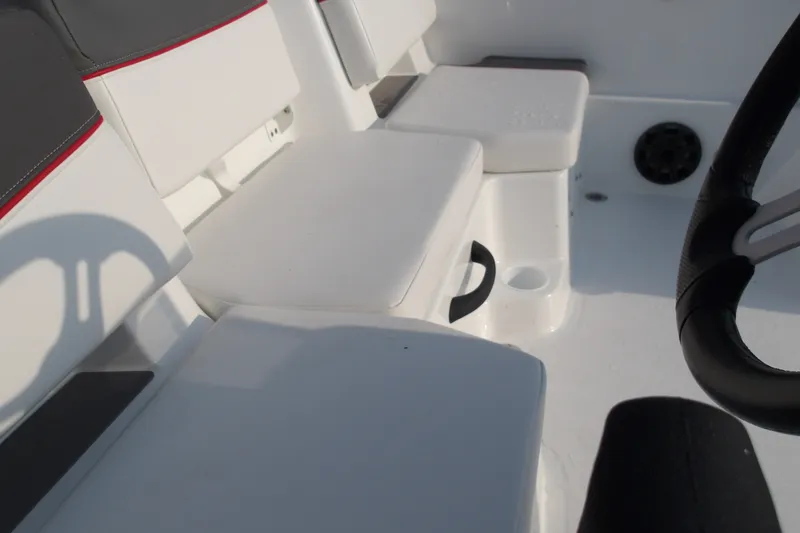 Slide: The Image of Interior seating of 2026 Tahoe T18 boat with steering wheel detail. - 23