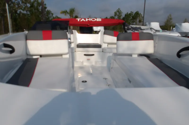 Slide: The Image of 2026 Tahoe T18 boat interior with red and gray seating, showcasing spacious design. - 5