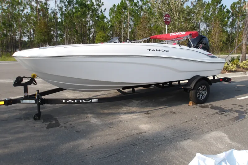 Slide: The Image of 2026 Tahoe T18 boat on trailer in outdoor setting. - 2