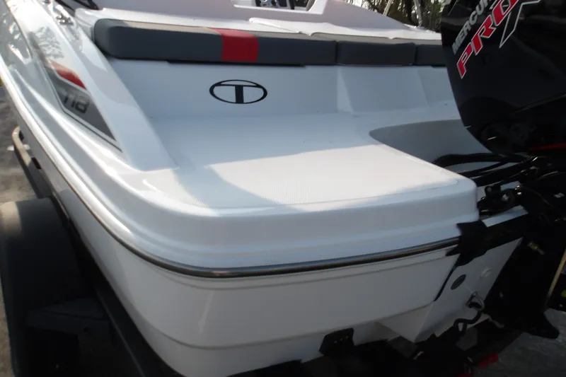 Slide: The Image of 2026 Tahoe T18 boat rear view with motor, featuring sleek white design. - 12