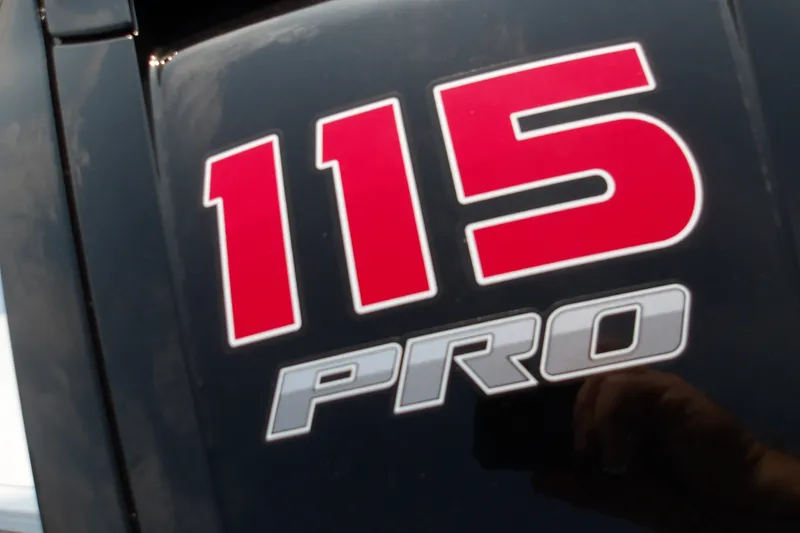 Slide: The Image of Close-up of 115 PRO logo on 2026 Tahoe T18 boat. - 11