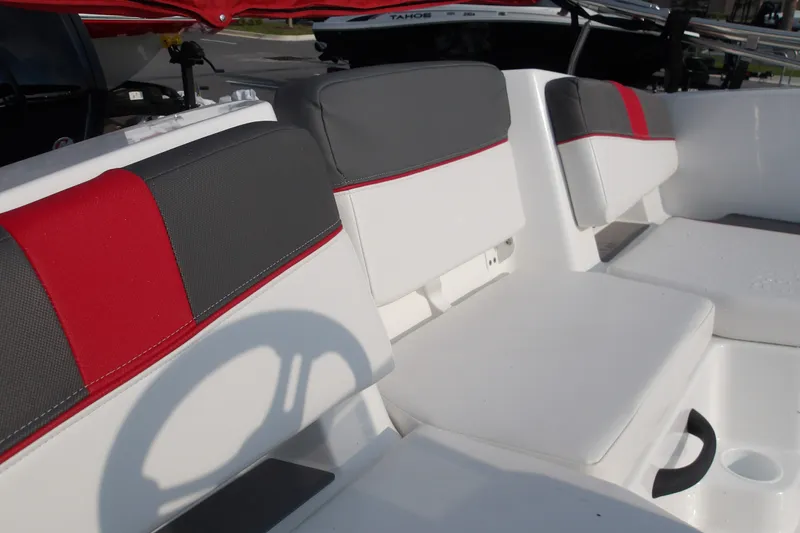 Slide: The Image of 2026 Tahoe T18 boat interior with red and gray seating, showcasing modern design. - 24