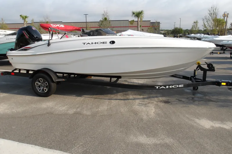 Slide: The Image of 2026 Tahoe T18 boat on trailer, displayed outdoors, showcasing sleek design and modern features. - 4