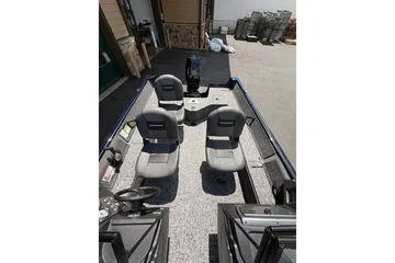 Slide: The Image of 2026 Tracker Pro Guide V-16 WT boat interior with seating and controls. - 4
