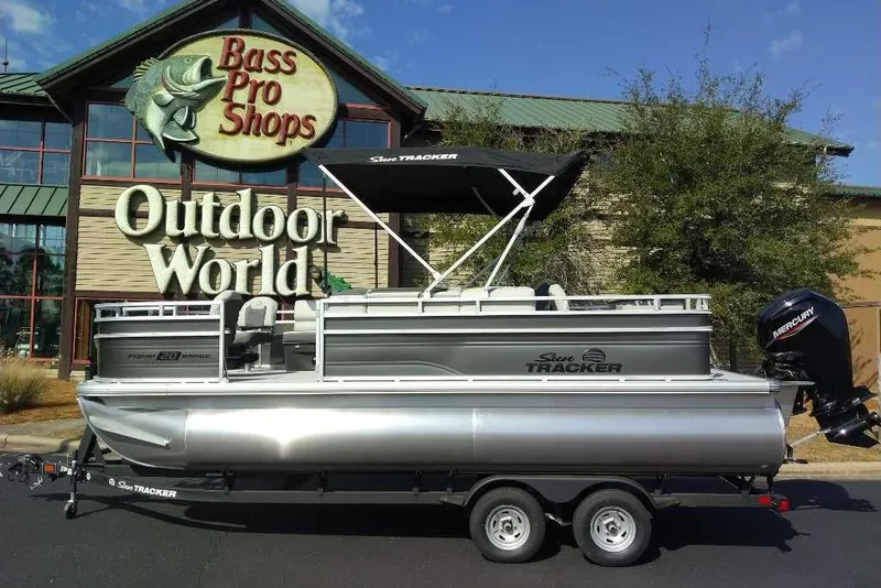 Slide: The Image of 2026 Sun Tracker Fishin' Barge 20 DLX pontoon boat at Bass Pro Shops Outdoor World. - 14