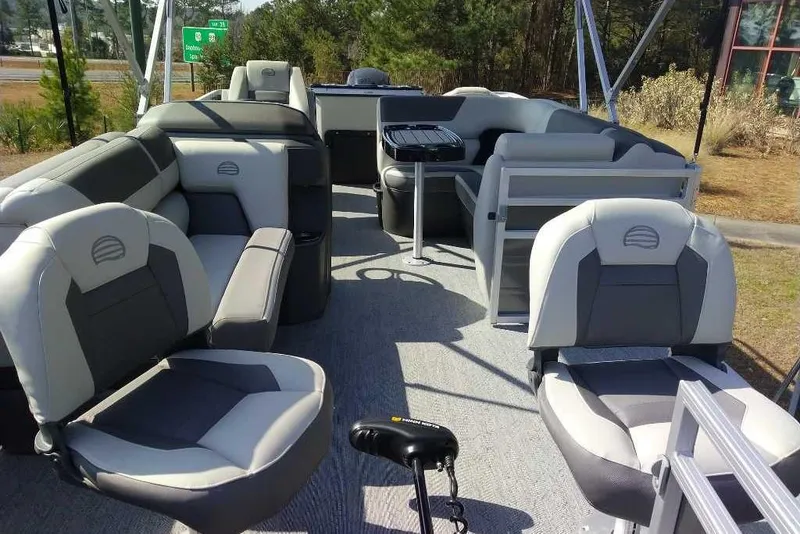 Slide: The Image of 2026 Sun Tracker Fishin' Barge 20 DLX interior with comfortable seating and fishing amenities. - 4