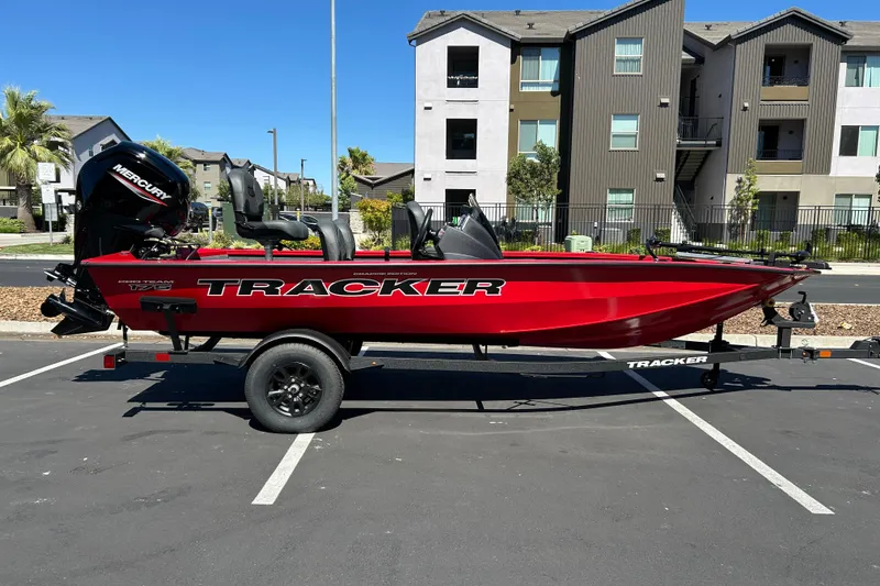 The Image of 2026 Tracker Pro Team 175 Crappie Edition boat in parking lot, vibrant red color. - 0