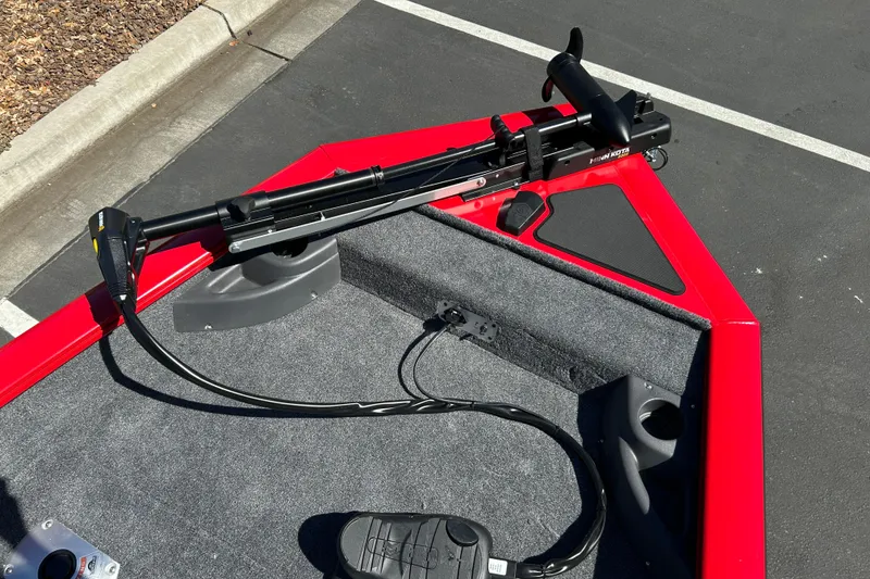 Slide: The Image of 2026 Tracker Pro Team 175 Crappie Edition boat with trolling motor on red deck. - 15