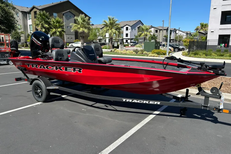 Slide: The Image of 2026 Tracker Pro Team 175 Crappie Edition boat in vibrant red, parked outdoors. - 3