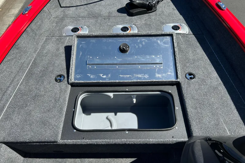 Slide: The Image of 2026 Tracker Pro Team 175 Crappie Edition boat interior with storage compartment open. - 14