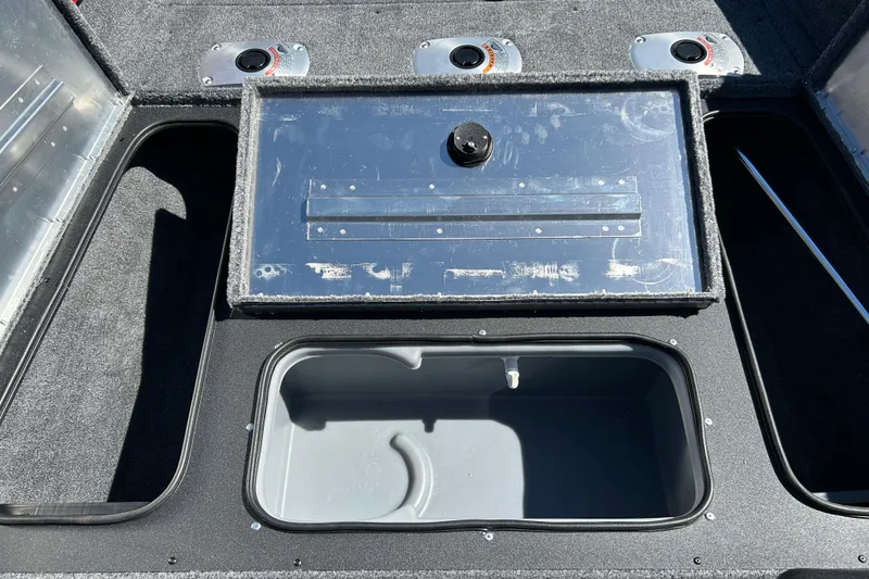 Slide: The Image of 2026 Tracker Pro Team 175 Crappie Edition boat storage compartments and livewell. - 13