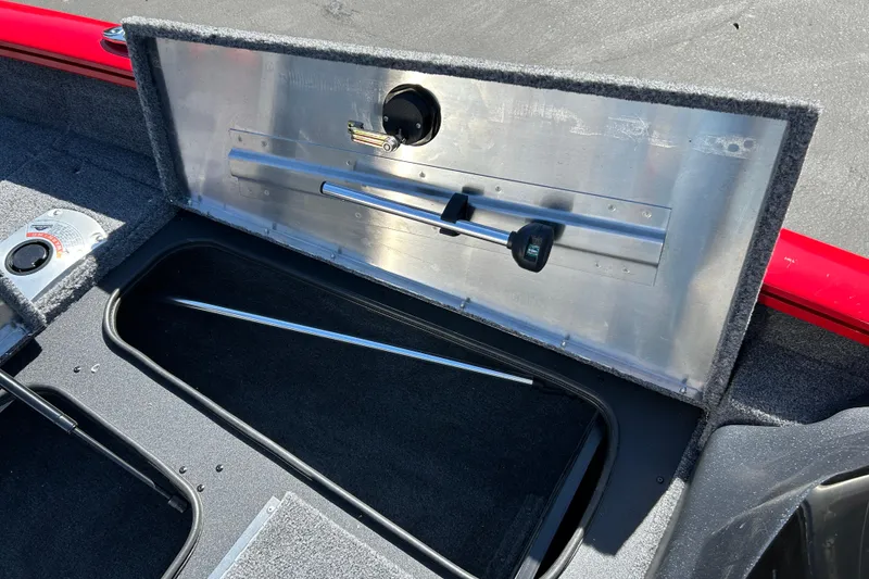 Slide: The Image of 2026 Tracker Pro Team 175 Crappie Edition boat storage compartment with open lid. - 12
