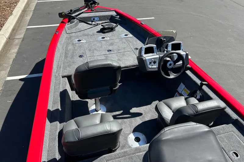 Slide: The Image of 2026 Tracker Pro Team 175 Crappie Edition boat with red trim and dual seats. - 19