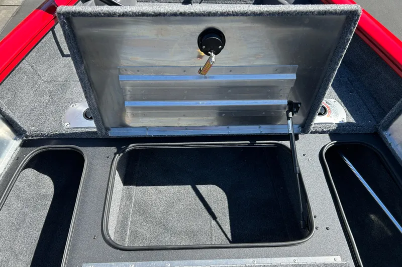 Slide: The Image of 2026 Tracker Pro Team 175 Crappie Edition boat interior storage compartment open. - 11