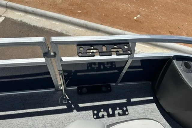 Slide: The Image of 2026 Sun Tracker Bass Buggy 18 DLX boat interior with seating and railing details. - 18
