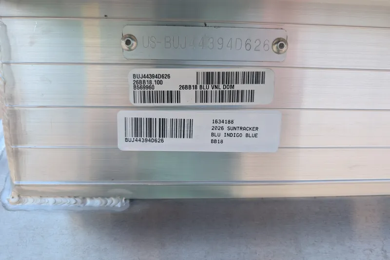 Slide: The Image of 2026 Sun Tracker Bass Buggy 18 DLX identification plate with barcodes and serial numbers. - 97