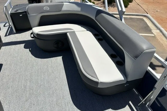Slide: The Image of 2026 Sun Tracker Bass Buggy 18 DLX pontoon boat with gray seating and cup holders. - 16