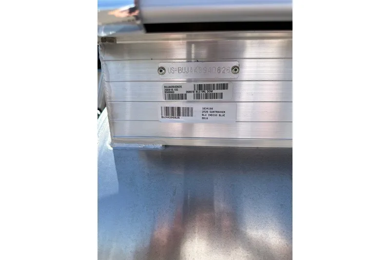 Slide: The Image of 2026 Sun Tracker Bass Buggy 18 DLX identification plate with serial numbers. - 98