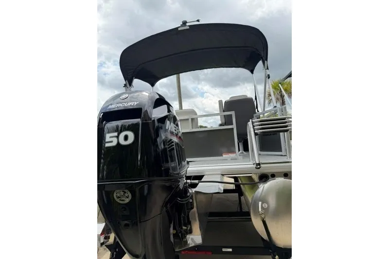 Slide: The Image of 2026 Sun Tracker Bass Buggy 16 XL Select with Mercury 50 engine, rear view. - 4