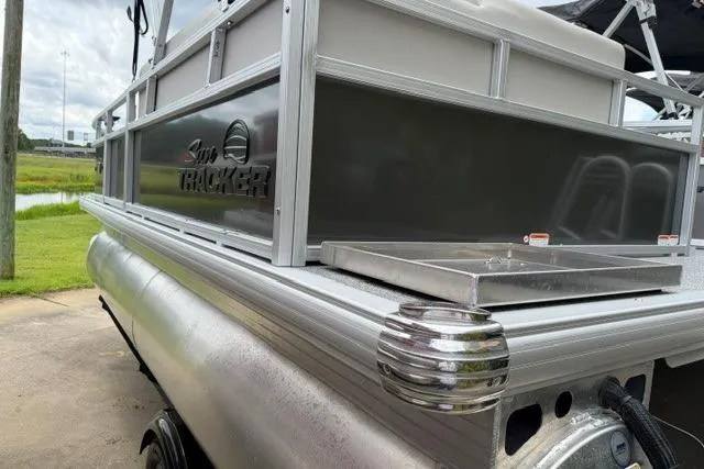 The Image of 2026 Sun Tracker Bass Buggy 16 XL Select pontoon boat, side view with logo. - 0