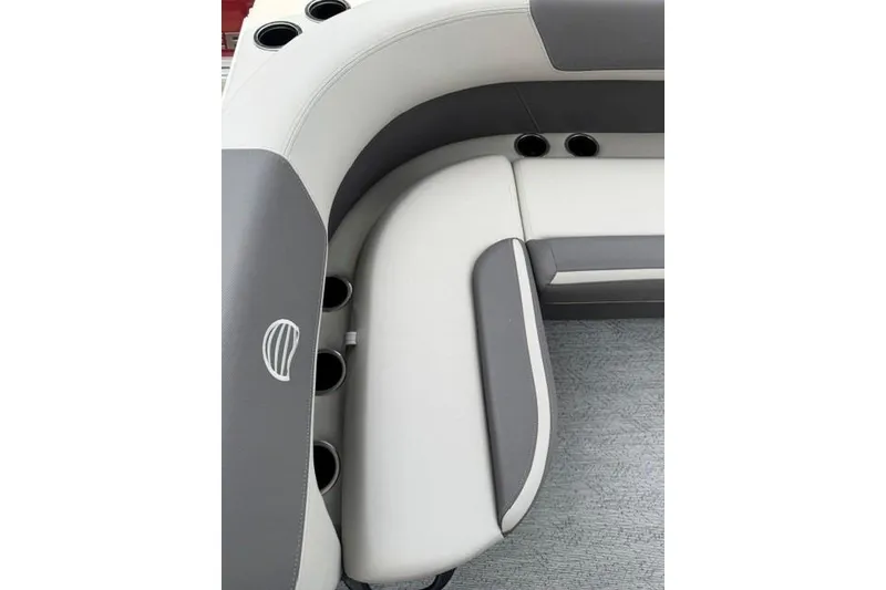 Slide: The Image of 2026 Sun Tracker Bass Buggy 16 XL Select boat seating with cup holders, featuring gray and white upholstery. - 12