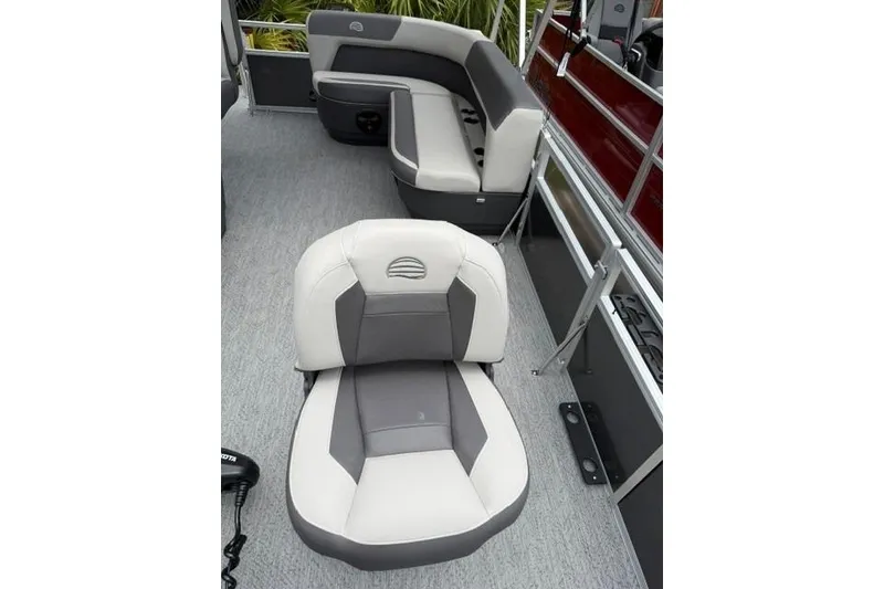 Slide: The Image of 2026 Sun Tracker Bass Buggy 16 XL Select interior with gray and white seating. - 8